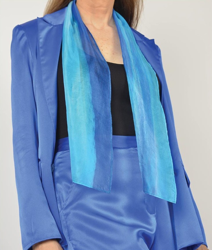 Ocean scarf worn over a blue suit